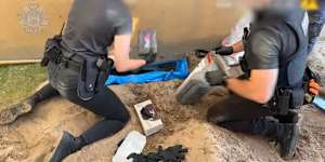 Police making the discovery of a cocaine haul underneath a concrete slab. 
