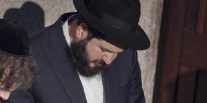 Javier Milei,centre,prays next to Chabad-Lubavitch rabbis. His representatives said he was converting to Judaism.