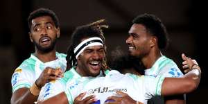 Fijian Drua players celebrate after scoring a try against the Chiefs in round four