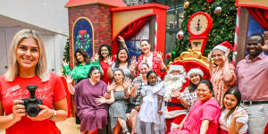 Say cheese:Morihovitis with staff from Annecto aged care and disability support services posing with Santa.