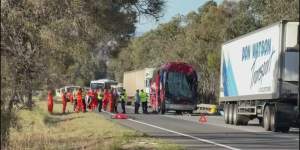 A bus driver has died and 13 passengers were taken to hospital after a crash on the Hume Highway on Saturday morning.