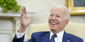 President Joe Biden laughs during his meeting with Iraqi Prime Minister Mustafa al-Kadhimi in the Oval Office of the White House in Washington,Monday.