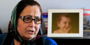 Ibtisam Berri with a picture of her granddaughter Lahala Elamine,at her home in the southern suburbs of Beirut.