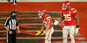 Tyrann Mathieu of the Kansas City Chiefs speaks with back judge Dino Paganelli following a pass interference call.