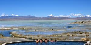 Tourists relax in the thermal pools in the Bolivian Altiplano.