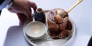 Grossi Florentino’s souffle is finished with sauce and ice-cream by the diner,which is part of its popularity.