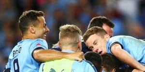 Home and hosed:Sydney FC celebrate winning the grand final earlier this month.