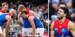 Demons players huddle around injured teammate Christian Petracca,before he leaves the field with a rib injury (right).