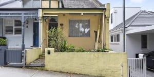 Young couple buy unliveable Bondi semi for $2.4m,beating eight others