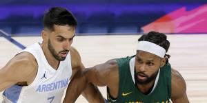 Patty Mills takes on Argentina’s Facundo Campazzo.