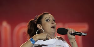 Comedian Celeste Barber addresses the crowd during Fire Fight Australia at ANZ Stadium on Sunday.