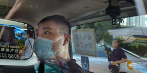 Tong Ying-kit arriving at a court in a police van in Hong Kong in July.