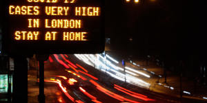 A sign near a highway in London urged people to stay at home.