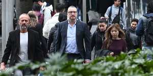 Jon Waldron,second from left,outside the Downing Centre District Court last month.