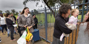 Melton residents wait in line at ADRA Community Care food relief centre.
