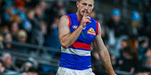 Will Lewis quiets the crowd after marking on the final siren in Adelaide.