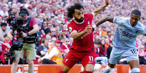 Liverpool top four hopes hit despite late equaliser,Everton grab vital point