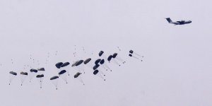 Parachutes drop supplies into the northern Gaza Strip,as seen from southern Israel this week.