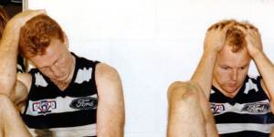 Barry Stoneham (left) and Billy Brownless looking dejected in the change rooms after the match.