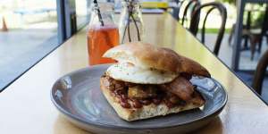 The bacon,egg and hash roll with house barbecue sauce.