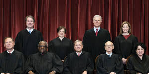 The Justices of the US Supreme Court,including Justice Clarence Thomas,seated second from left.