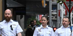 Paramedics Kingsley Newman (left) and Anna Hofner (centre) arrive to give evidence at the trial of Senior Constable Kristian White.