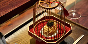 "Sea treasure"ball presented in a wooden birdcage.