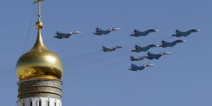 Flexing its muscle ... Russian military jets fly above the Kremlin,with the Ivan the Great Bell Tower seen in the foreground,during the Victory Day parade in Moscow's Red Square.