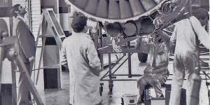 John Bibo inspects a Rolls-Royce RB 211 bypass fan.