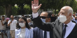 Tunisian President Kais Saied waves to bystanders as he stroll along the avenue Bourguiba in Tunis,Tunisia.