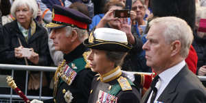 King Charles III,Princess Anne and Prince Andrew walk behind the Queen’s coffin.