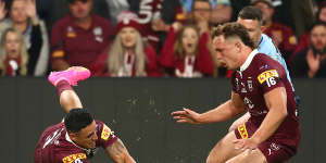 Valentine Holmes scores a controversial opening try for Queensland.