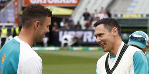 Scott Boland gets his baggy green cap from Josh Hazlewood before the third Test against England at the MCG in 2021.