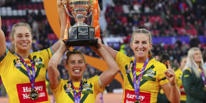 The Australian team celebrate with the World Cup. 