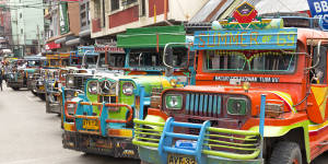 A Manila institution… multi-coloured Jeepneys seen lined up at a station.