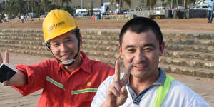 Chinese construction workers relax at the Galle Face Green,near the Port City Colombo reclamation site.