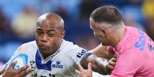 Mark Tele’a of the Blues is tackled
