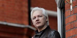 Julian Assange speaks to the media from the balcony of the Ecuadorian embassy in May 2017.