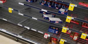 Supplies of staples such as pasta,rice,UHT milk and canned foods were running low at Woolworths and Coles amid panic hoarding. 