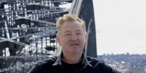 Chef Luke Mangan on a pylon on the Sydney Harbour Bridge.