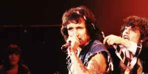 Bon Scott fronts AC/DC in Hollywood in 1977 as lead guitarist Angus Young finds an alternative use for his school tie.