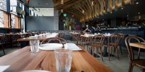 The restaurant has repurposed wooden beams from Bega Flats for the ceiling and tables. 