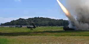 In this photo released by China’s Xinhua News Agency,a projectile is launched from an unspecified location in China during long-range live-fire drills on Thursday.