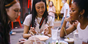 A group of multi-ethnic female friends enjoying street food on Yaowarat Road or Chinatown in Bangkok,Thailand. iStock image for Traveller. Re-use permitted.