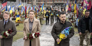 Zelensky with Danish Prime Minister Mette Frederiksen (centre) and her husband Bo Tengberg (left) on Friday at a wreath laying ceremony at a cemetery in Lviv,Ukraine.
