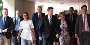 New and old Labor MPs walk into the first caucus meeting following the Queensland election.