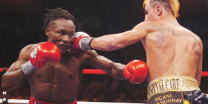 Ndou trades blows with Paulie Malignaggi in 2007.