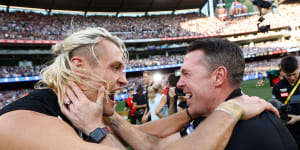 Captain Darcy Moore and coach Craig McRae celebrate Collingwood’s win over Brisbane.