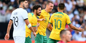 Mitchell Duke (second from right) celebrates after scoring a goal during an international friendly match against New Zealand in September.