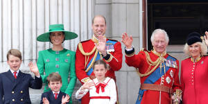 King Charles and Queen Camilla wave alongside Prince William,Prince Louis,Princess Charlotte,Catherine,Princess of Wales and Prince George on the Buckingham Palace balcony.